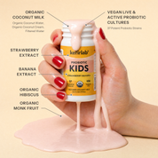 kefirlab Kids probiotic shot bottle pouring strawberry banana drink, hands