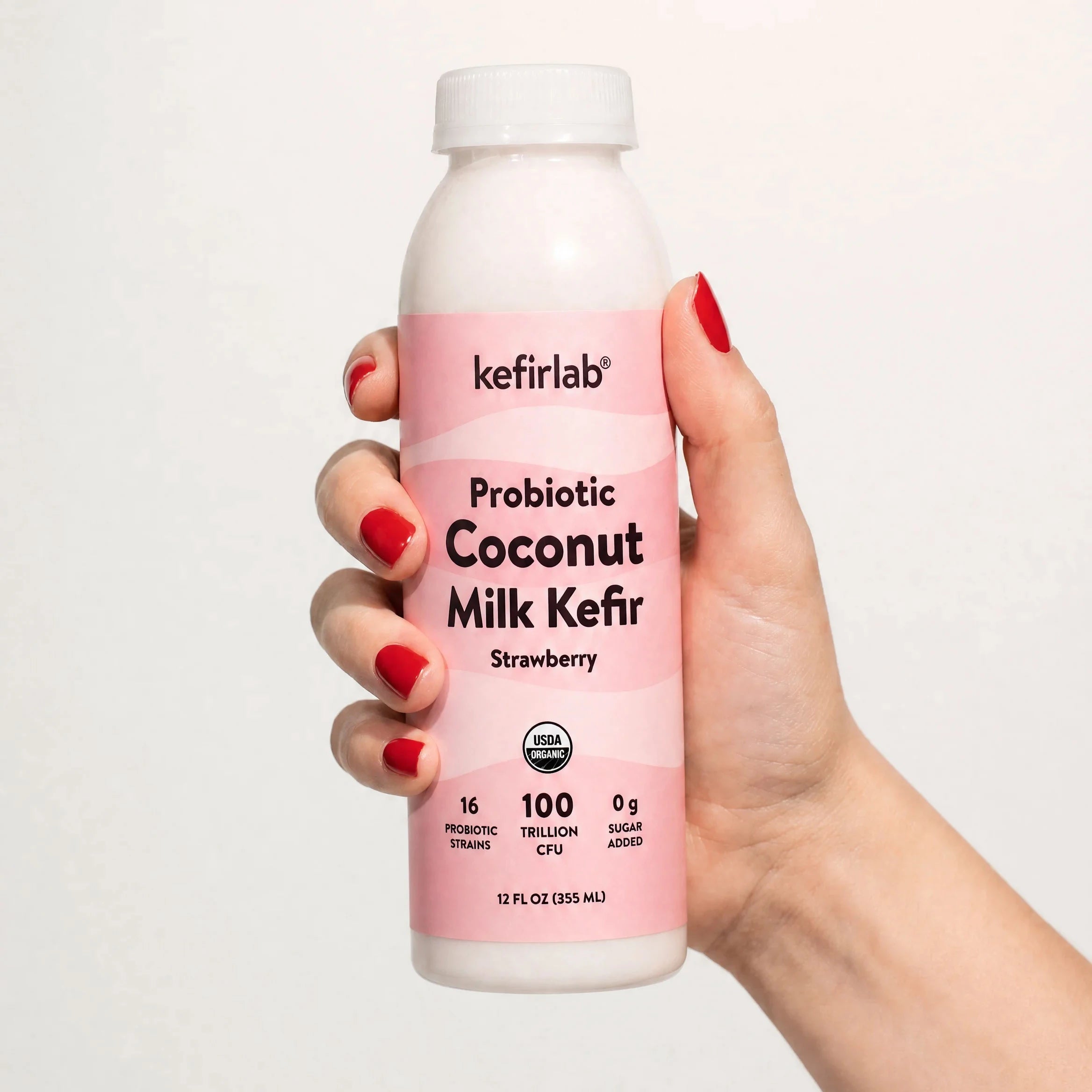 kefirlab® probiotic coconut milk kefir bottle, strawberry flavor, pink label, 12 fl oz