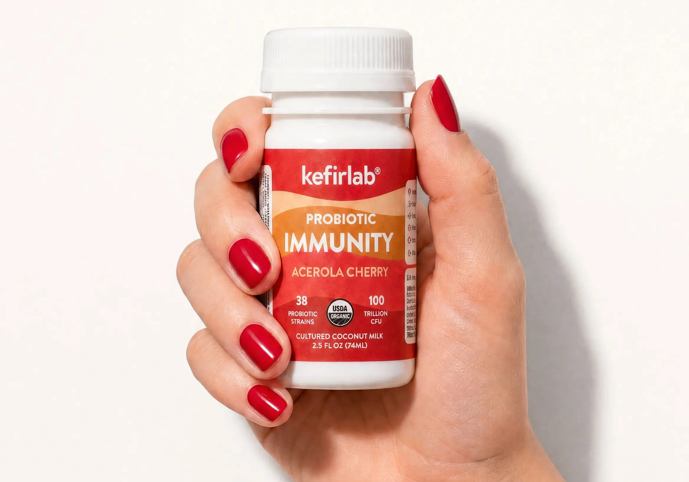 KefirLab probiotic immunity acerola cherry shot bottle, white cap, orange label