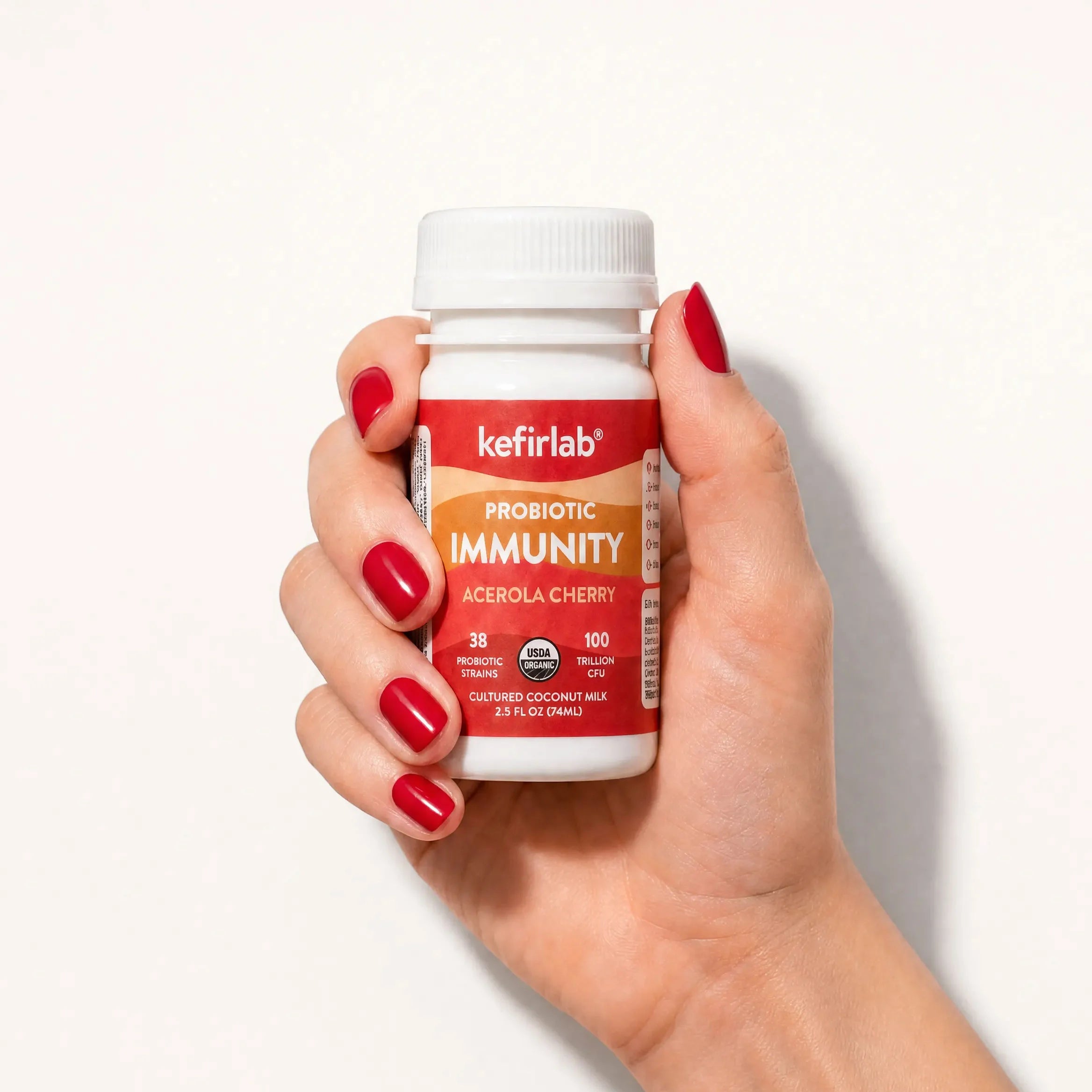 KefirLab probiotic immunity acerola cherry shot bottle, white cap, orange label