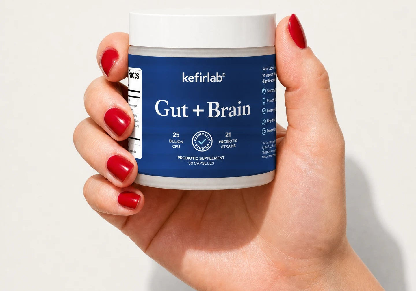 Probiotic supplement jar with blue label and white lid, Gut + Brain by kefirlab