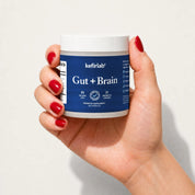 Probiotic supplement jar with blue label and white lid, Gut + Brain by kefirlab